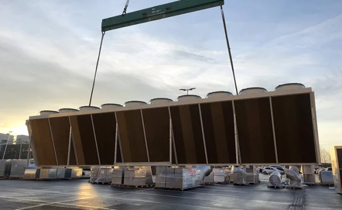 Picture of a dry cooler being lifted with a crane